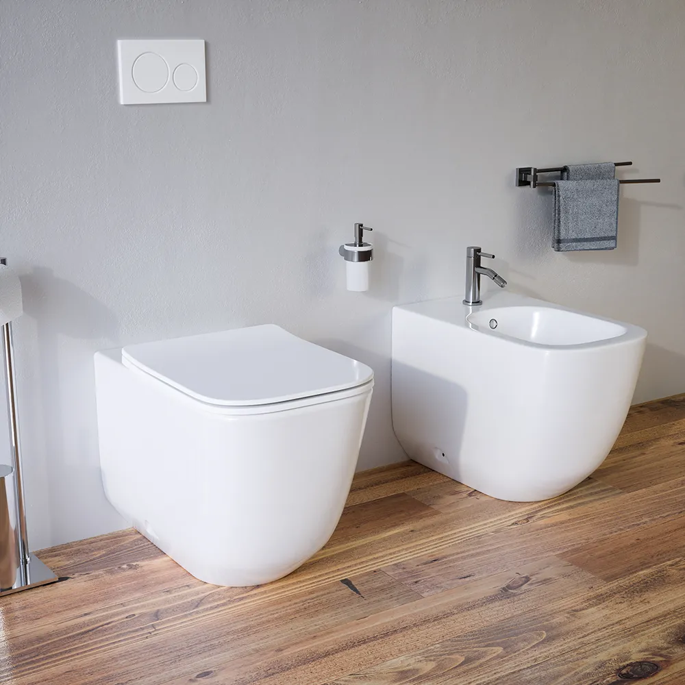 Sanitari filomuro in ceramica bianco lucido vaso tornado silent flush sedile soft-close e bidet | Riga Sanitari filomuro in ceramica bianco lucido vaso tornado silent flush sedile soft-close e bidet | Riga