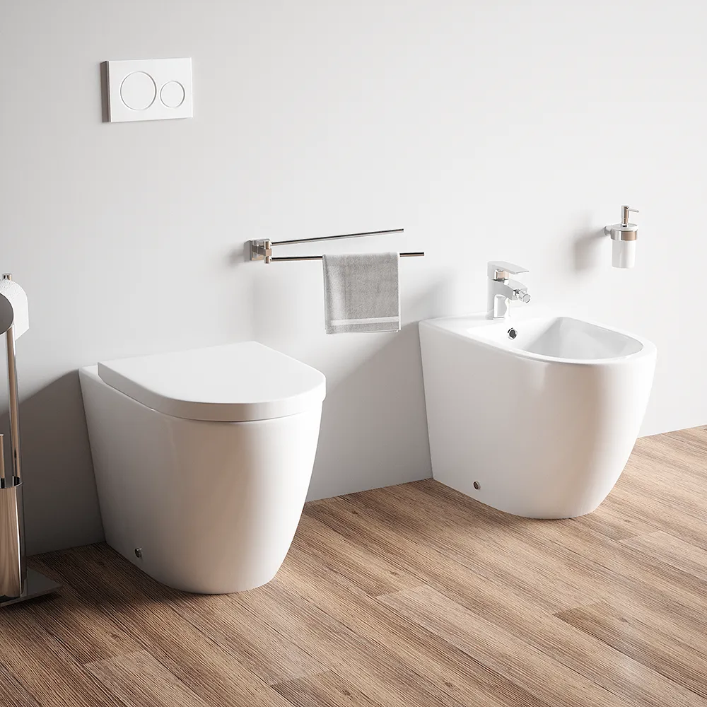 Sanitari filo muro in ceramica senza brida vaso traslato + bidet + sedile soft-close | Roma Sanitari filo muro in ceramica senza brida vaso traslato + bidet + sedile soft-close | Roma