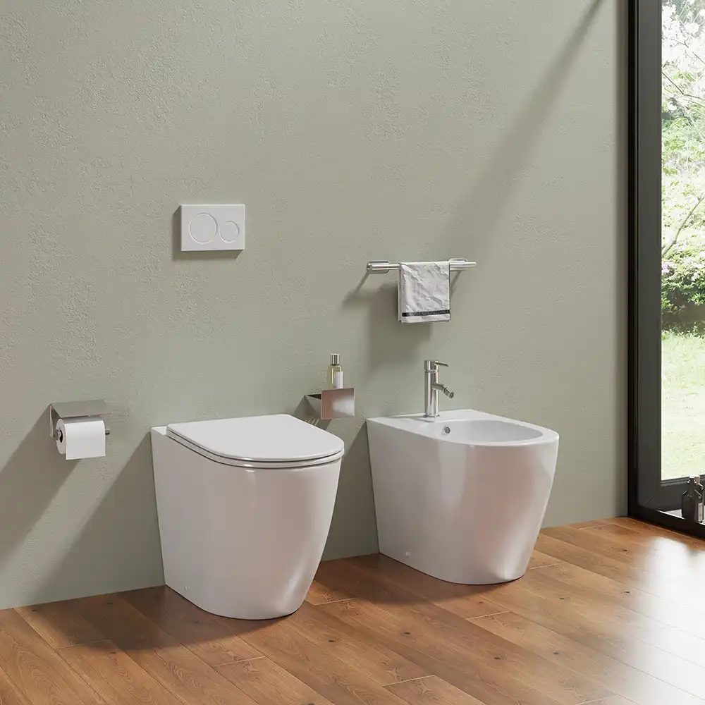 Sanitari filomuro in ceramica wc+bidet rimless mod. Europa bianco lucido - Vista diagonale Sanitari filomuro in ceramica wc+bidet rimless mod. Europa bianco lucido - Vista diagonale